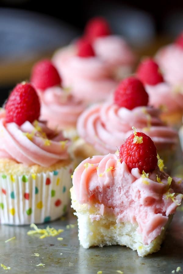 rows of lemon angel food cupcakes with raspberry buttercream