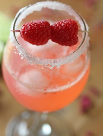 close up shot of raspberry rosewater gin rickey in glass