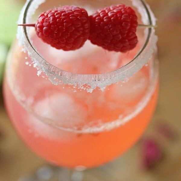 close up shot of raspberry rosewater gin rickey in glass