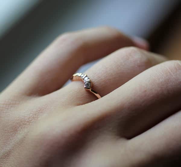 picture of a diamond engagement ring on her finger