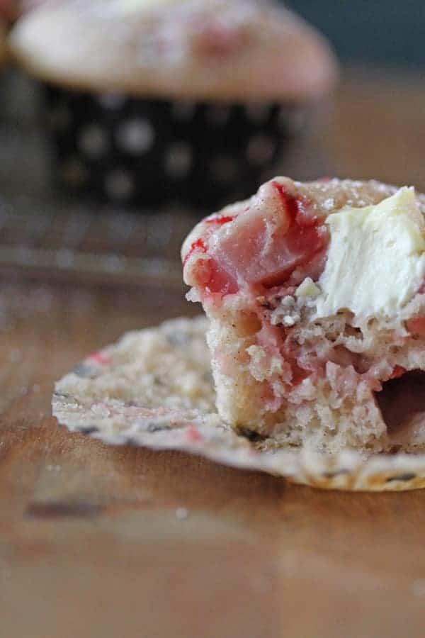 Close up view of a Cream Cheese Muffin with a large bite taken out of it