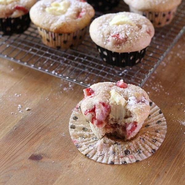 strawberries and cream cheese muffins on wire rack