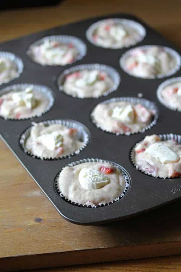 Batter for the Cream Cheese Muffins in a muffin tin before baking