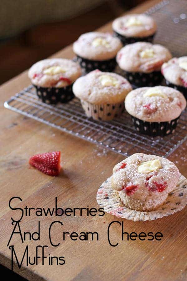 Strawberries and Cream Cheese Muffins cooling on a wire rack