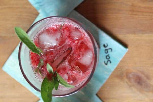 Overhead view of Raspberry Smash Cocktail with Sage