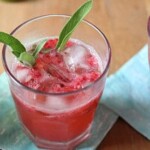 raspberry smash cocktail on blue napkin