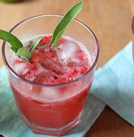 raspberry smash cocktail on blue napkin