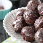 pile of guinness chocolate glazed donut holes in white bowl