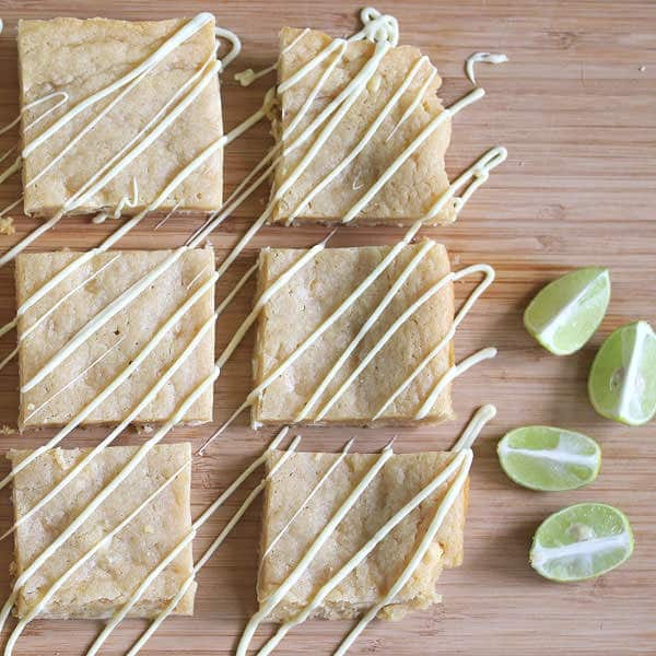 Overhead view of six Key Lime Blondies with white chocolate drizzled on top