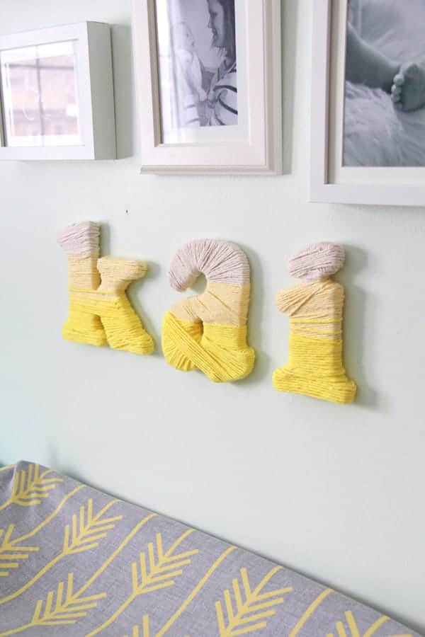 Side view of Ombre Yarn-Wrapped Letters hanging on wall