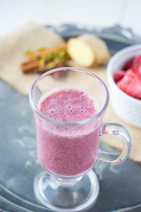 strawberry vanilla chai smoothie in glass