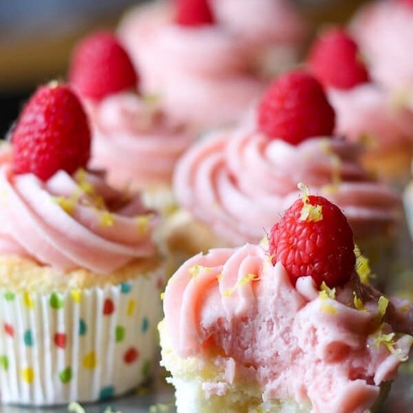 rows of lemon angel food cupcakes with raspberry buttercream
