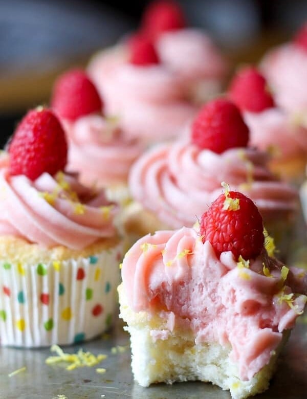 rows of lemon angel food cupcakes with raspberry buttercream