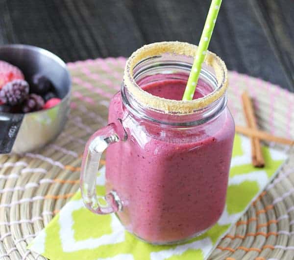 triple berry pie smoothie in mason jar with green straw