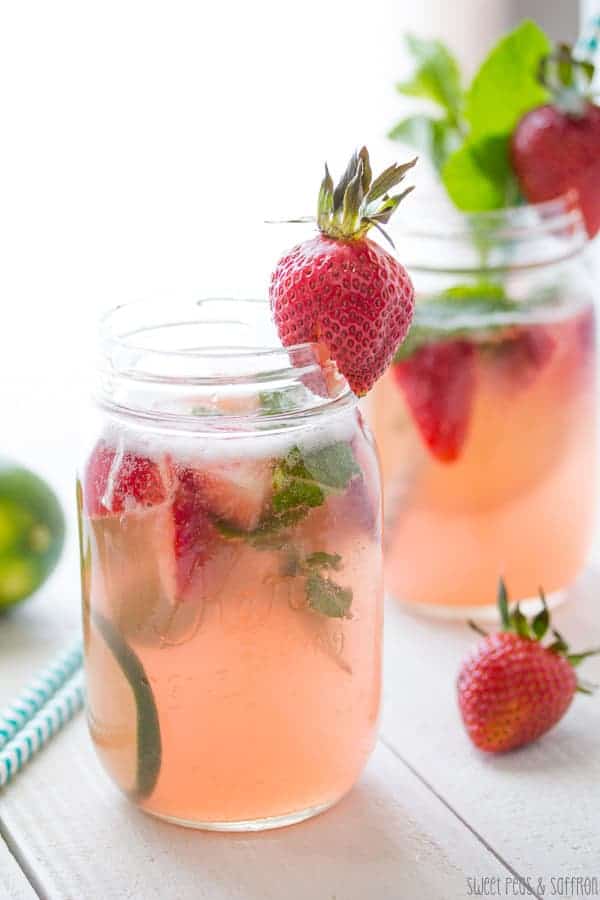 Rosé Sangria in two mason jars with fresh strawberries