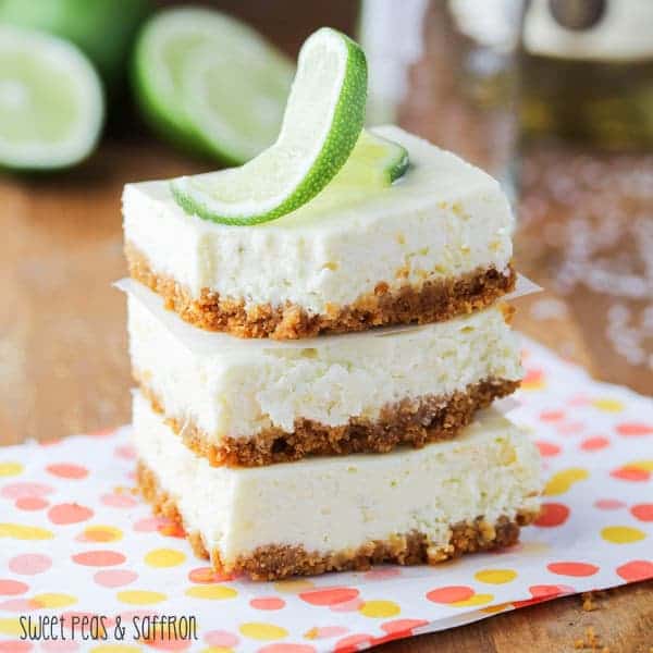 Stack of three Lime Cheesecake Bars on a colorful napkin