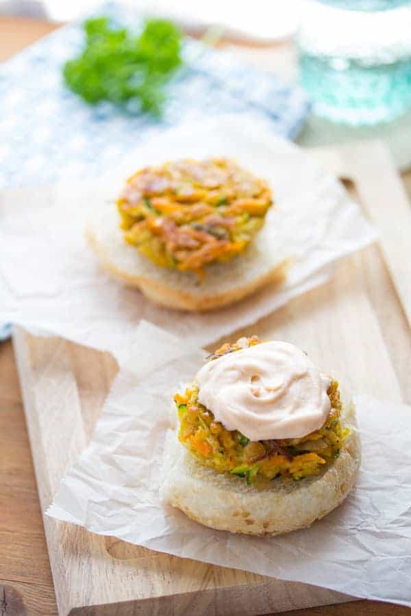 Mini Moroccan Chickpea Burgers on an open bun with spicy harissa mayo