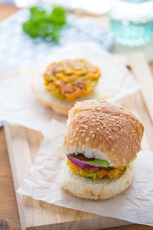 Close up view of Mini Moroccan Chickpea Burgers on top of parchment paper