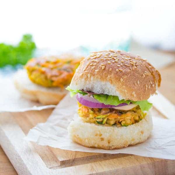 Mini Moroccan Chickpea Burgers on parchment paper and cutting board