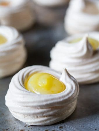 close up of lemon meringue pie bites on sheet pan