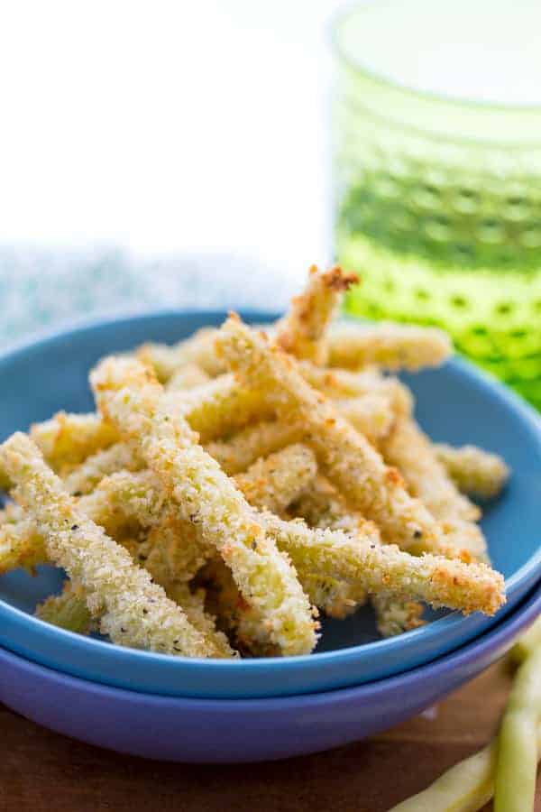 Crispy Parmesan Baked Green Bean Fries in stacked blue bowls