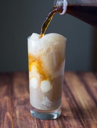 spiced baileys root beer float being poured into glass