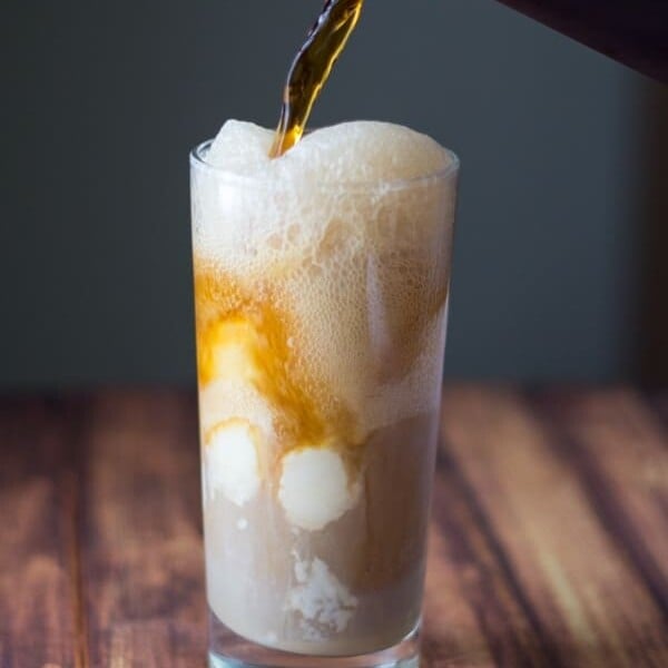 spiced baileys root beer float being poured into glass