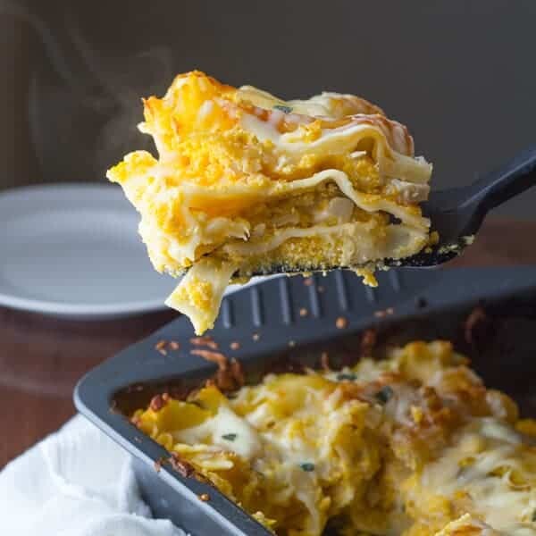 butternut squash lasagna with spatula taking out a slice