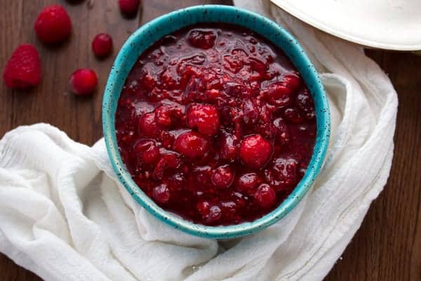 Overhead view of Raspberry Balsamic Cranberry Sauce in blue bowl