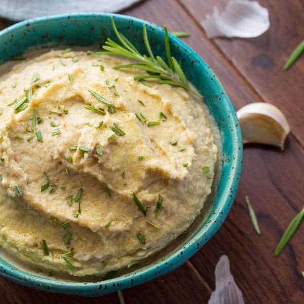 white bean hummus in blue bowl