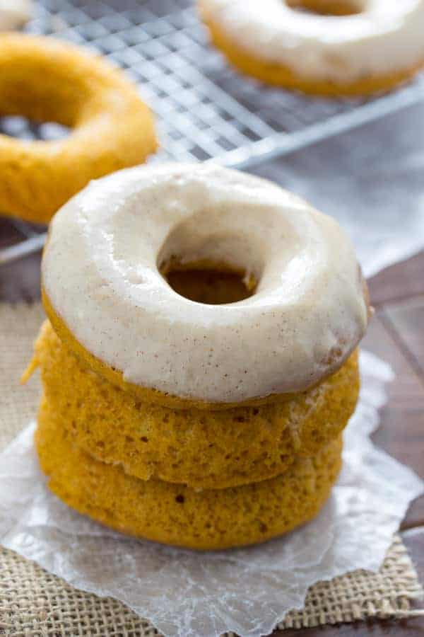Stack of three Baked Pumpkin Donuts with one frosted