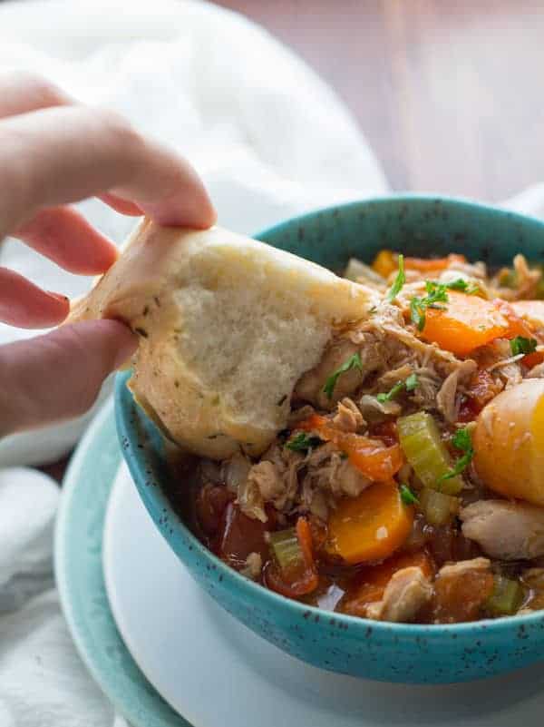 slow cooker stew in a blue bowl