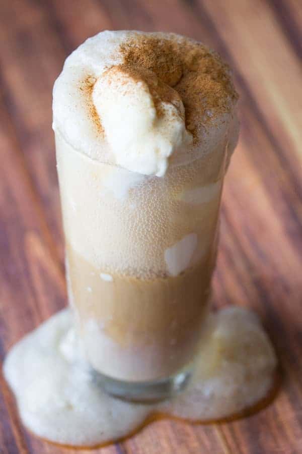 Root Beer Float in tall glass with sprinkle of cinnamon on top