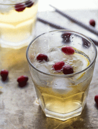 video of cranberry ginger cider cocktail being poured into glass