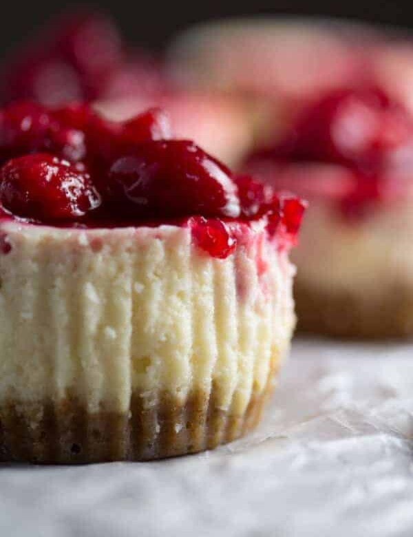 side view of leftover cranberry sauce mini cheesecake on parchment
