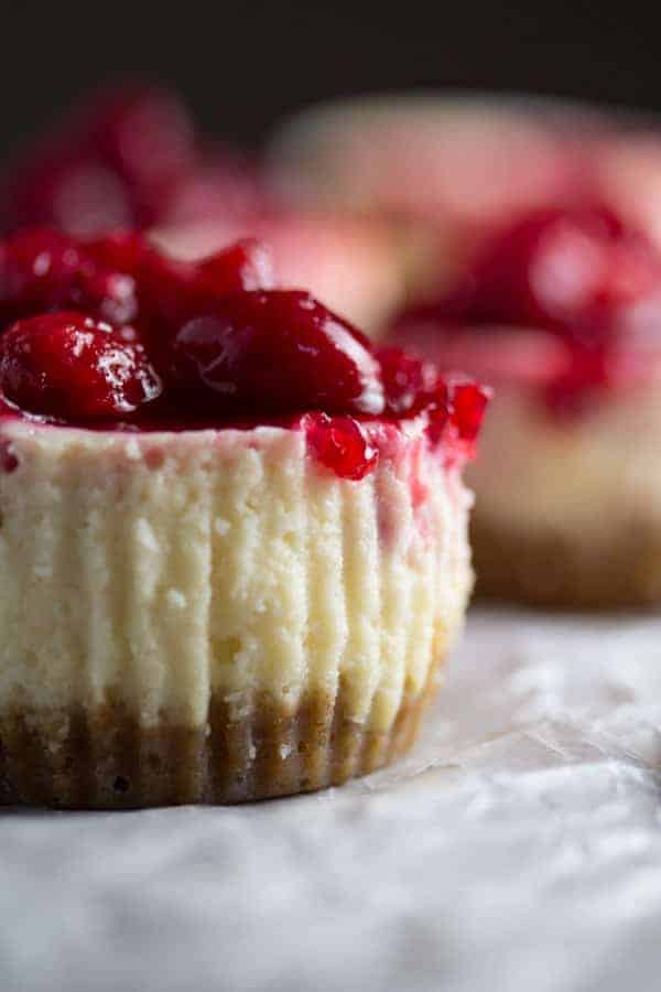 Close up side view of Cranberry Sauce Mini Cheesecake without wrapper