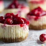 side view of leftover cranberry sauce mini cheesecakes on parchment