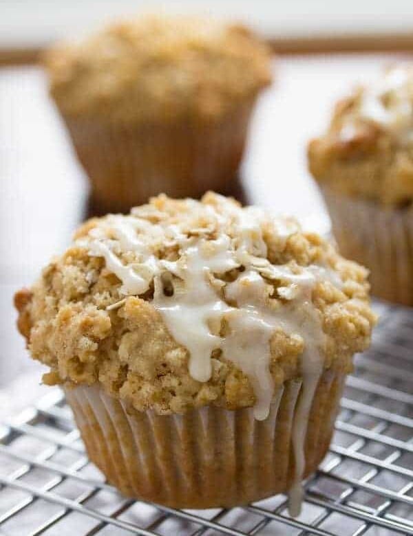 close up shot of glazed maple walnut oatmeal muffins on wire rack