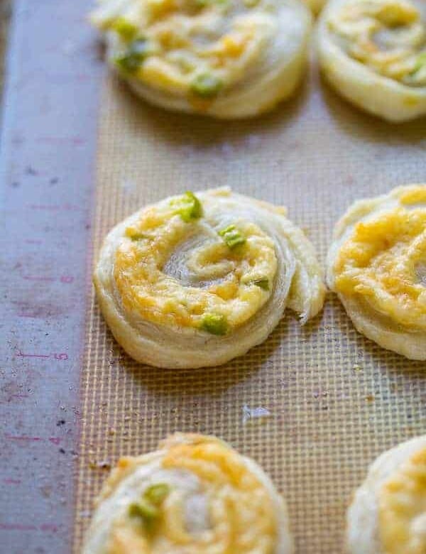 jalapeno and smoked gouda puff pastry pinwheels on silicone tray