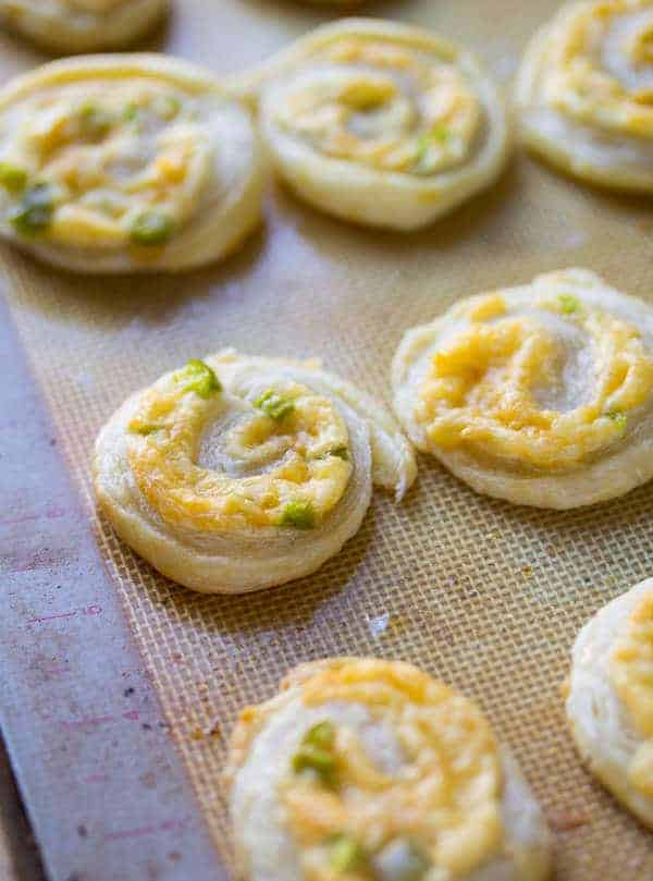 Smoked Gouda Puff Pastry Pinwheel Appetizers on silicone baking mat