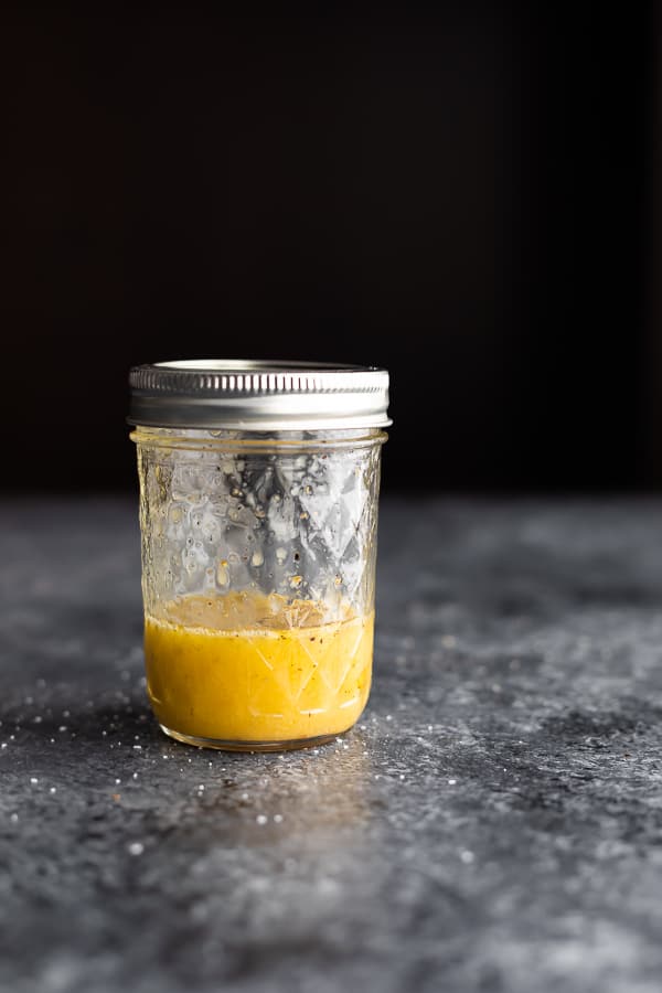 side view of ½ pint jar with white wine vinaigrette