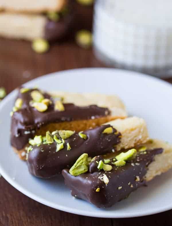 Chocolate Dipped Cardamom Shortbread Cookies on a plate