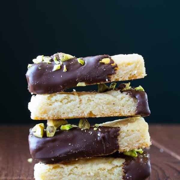 stack of cardamom and chocolate shortbread cookies with salted pistachios