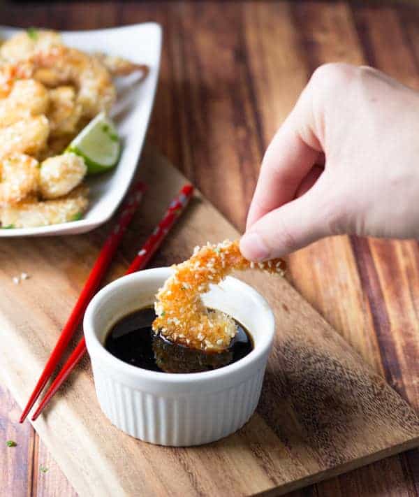 dipping sesame shrimp in sauce