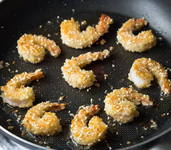 cooking sesame shrimp in frying pan