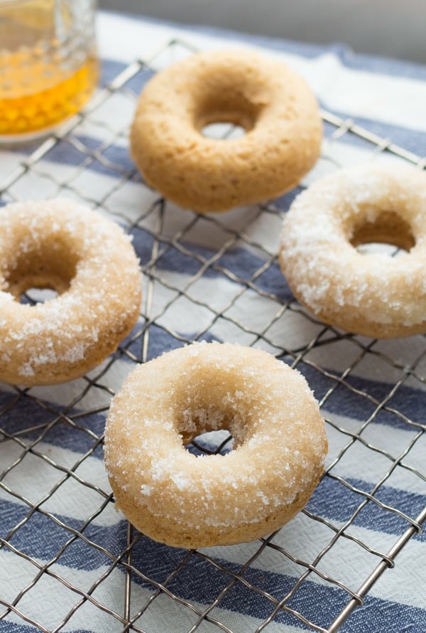 4 Bourbon-Sugared French Toast Donuts on a wire baking rack