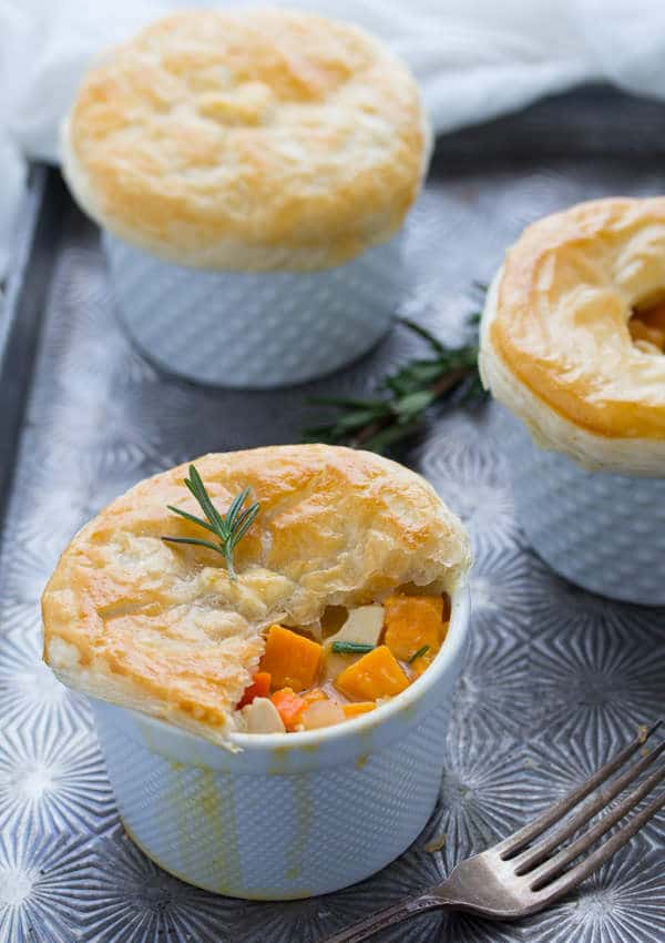 3 Rosemary Sweet Potato Chicken Pot Pies on baking sheet with pastry of one broken open