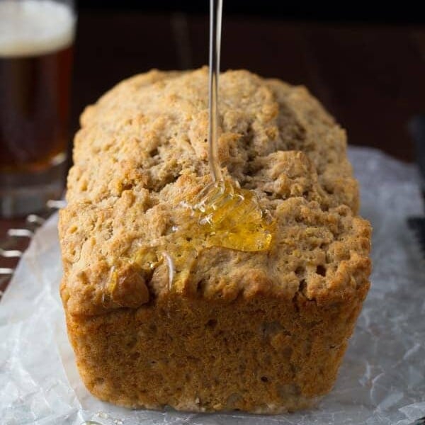 honey rye beer bread with honey drizzled on it