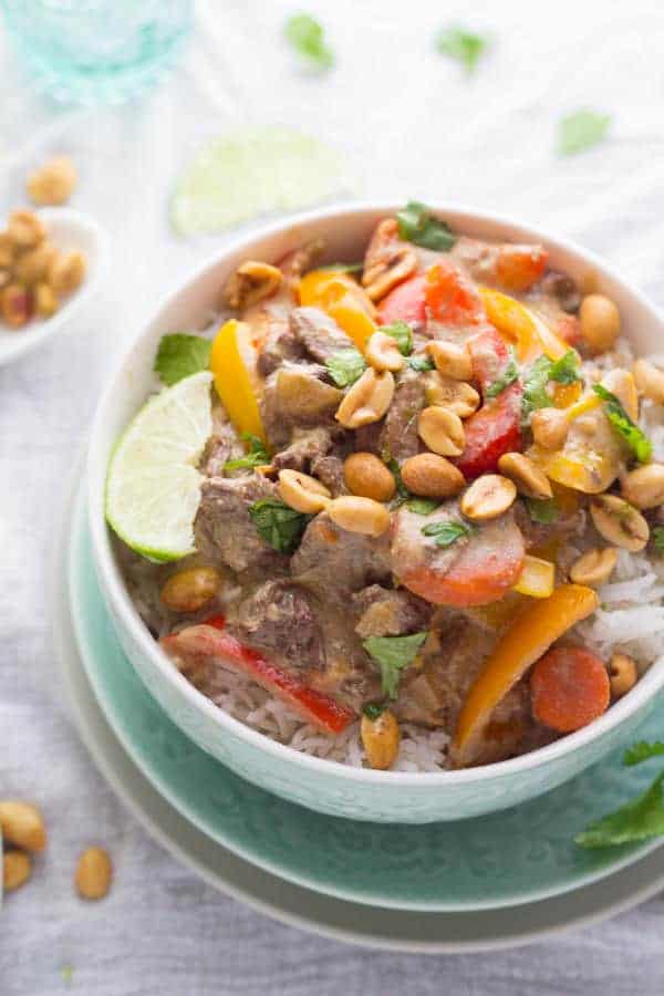 slow cooker thai curry beef in a bowl with rice