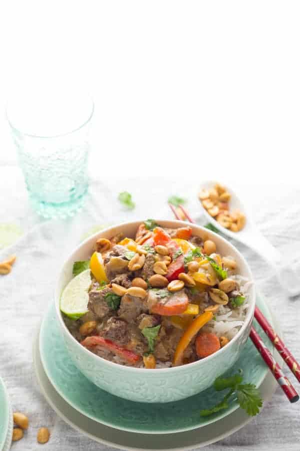 side angle view of bowl of thai curry beef on rice